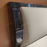 Soft Upholstered Bed with Embossed Brand Mark, Rich-Patterned Natural Wood Veneer Trim & Polished Gold Stainless Steel Accents